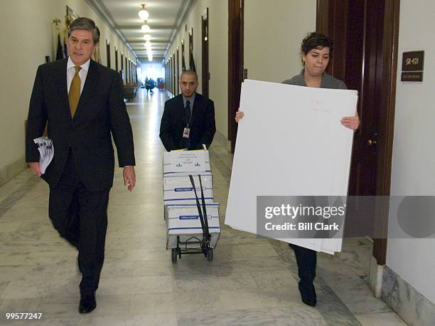 From left, Sen. Gordon Smith, R-Ore., intern Adam Renon and intern Lindy Hawkins head to the Senate floor on Monday, Feb. 12 for Sen. Smith's...