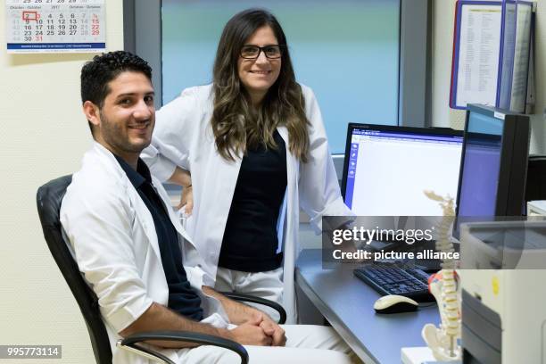 The Argentinian doctors Alvaro Navarro and Diana Grau, photographed at a treatment room of the Borromaeus Hospital in Leer, Germany, 2 October 2017....