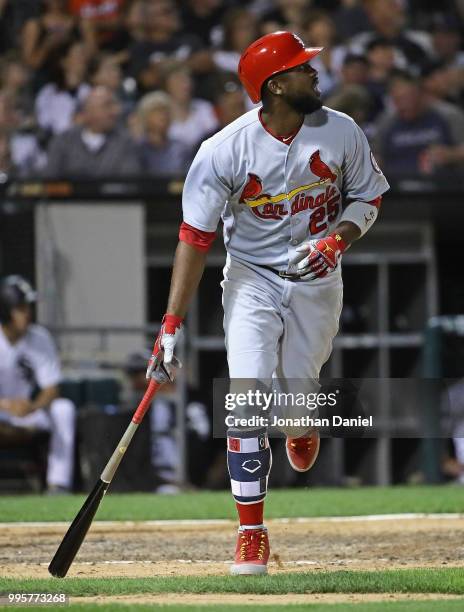 Dexter Fowler of the St. Louis Cardinals follows the flight of his grand slam home run in the 6th inning against the Chicago White Sox at Guaranteed...