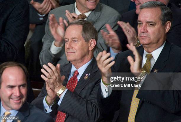 From left, Rep. Zach Wamp, R-Tenn., Rep. Joe Wilson, R-S.C., and Rep. Jeff Miller, R-Fla., clap as President Barack Obama delivers his first State of...