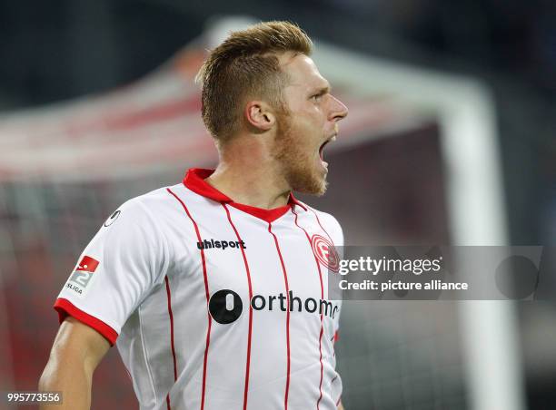 Duesseldorf's Rouwen Hennings celebrates his 1:0 goal during the German 2nd Bundesliga soccer match between Fortuna Duesseldorf and MSV Duisburg at...