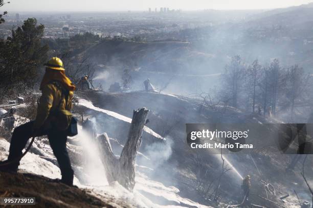 Firefighters work on the Griffith fire at Griffith Park, on July 10, 2018 in Los Angeles, California. Tourists had to be evacuated from the 10-acre...