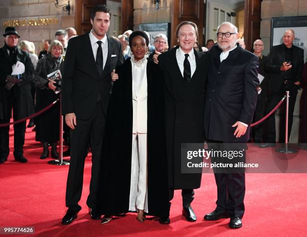 Musician Marius Mueller-Westernhagen and his wife Lindiwe Suttle are greeted by the directors Juergen Flimm and Matthias Schulz at the reopening of...