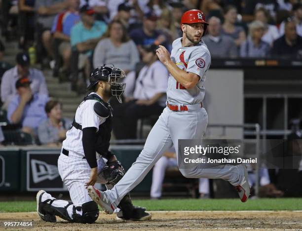 Paul DeJong of the St. Louis Cardinals scores a run in the 5th inning past Omar Narvaez of the Chicago White Sox at Guaranteed Rate Field on July 10,...