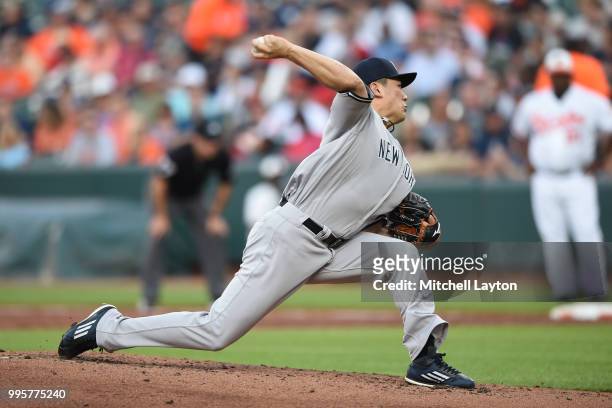 Masahiro Tanaka of the New York Yankees pitches in the second inning during a baseball game against the Baltimore Orioles at Oriole Park at Camden...