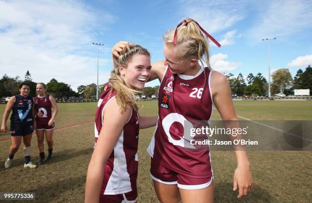 Queensland's Lily Postlethwaite and Serene Watson celebrate during the AFLW U18 Championships match between Queensland and Vic Metro at Broadbeach...