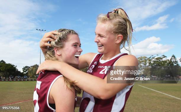 Queensland's Lily Postlethwaite and Serene Watson celebrate during the AFLW U18 Championships match between Queensland and Vic Metro at Broadbeach...