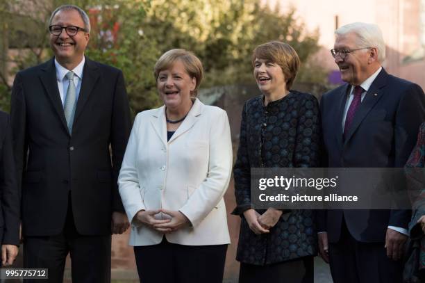 The president of the Federal Constitutional Court of Germany Andreas Vosskuhle , German Chancellor Angela Merkel , wife of the German president Elke...