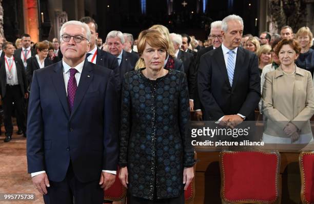 German President Frank-Walter Steinmeier and his wife Elke Buedenbender took their seats in the presence of Saxony's Premier Stanislav Tillich and...
