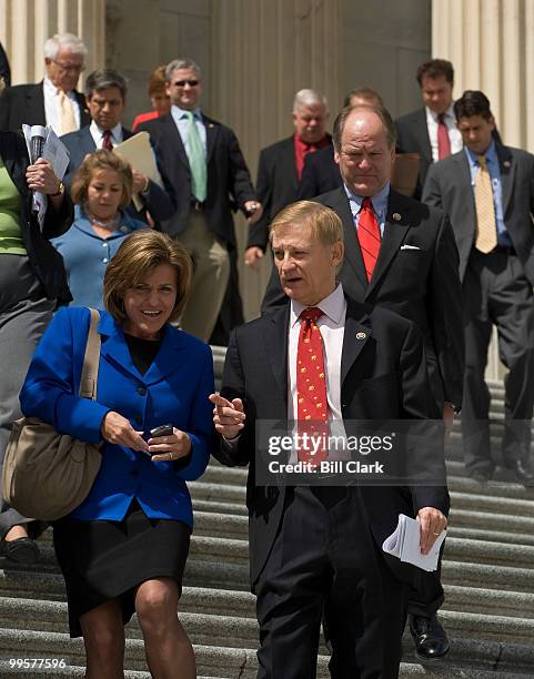 Rep. Lynn Jenkins, R-Kansas, and Rep. Spencer Bachus, R-Ala., walk down the House Steps with other members of Congress following a vote on Thursday,...