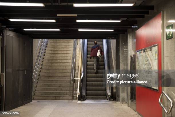 Man takes an escalator during a strike limiting public transport services in a subway station in Barcelona, Spain, 03 October 2017. Labor unions and...