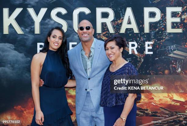 Actor Dwayne Johnson, his daughter Simone Alexandra Johnson and his mother Ata Johnson attend the premiere of 'Skyscraper' on July 10, 2018 in New...