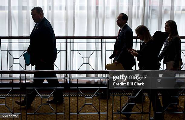 Sen. John Tester, D-Mont., left, leaves the Capital Hilton hotel after speaking to the National Rural Health Association's 21st Annual Rural Health...