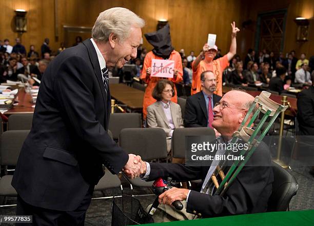 Sen. Joe Lieberman, I-Conn., shakes hands with Richard Shiffrin, former deputy general counsel for intelligence at the Defense Department, before the...