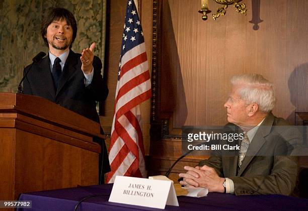 Librarian of Congress James Billington listens as filmmaker Ken Burns speaks during the news conference to announce the National Veterans Video Oral...