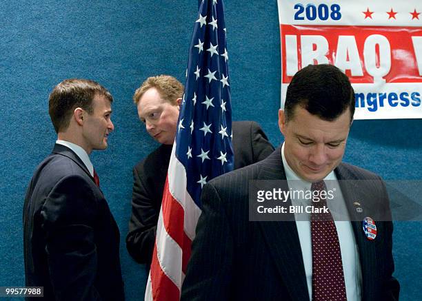 From left, candidates for Congress Tom Roughneen, R-N.J., speaks with Duane Sand, R-N.Dak., before the start of the Iraq Veterans for Congress news...