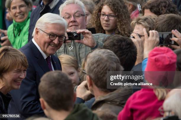German President Frank-Walter Steinmeier mingles in the crowd during the central celebration of the German Unity Day in Mainz, Germany, 03 October...