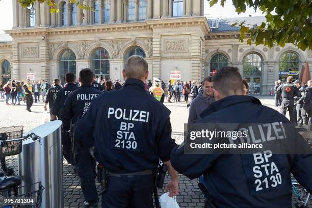 Police officers patrol during the central celebration of the German Unity Day in the Rheingoldhalle in Mainz, Germany, 03 October 2017. The festivity...