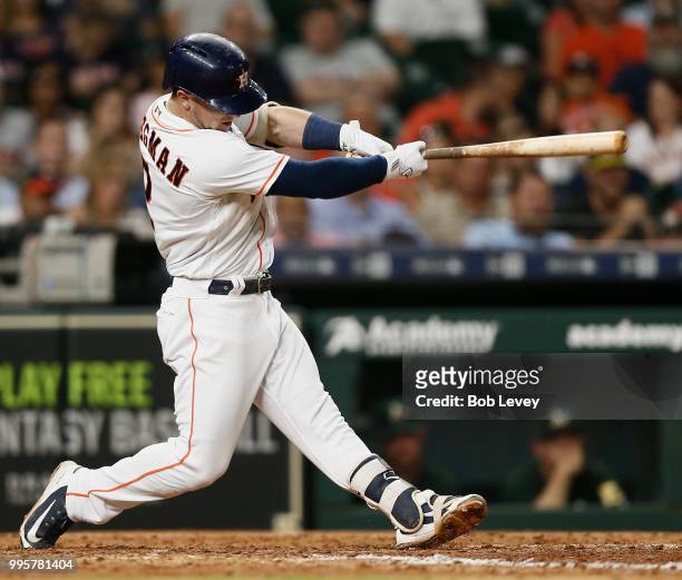 Alex Bregman of the Houston Astros hits a home run in the seventh inning against the Oakland Athletics at Minute Maid Park on July 10, 2018 in...