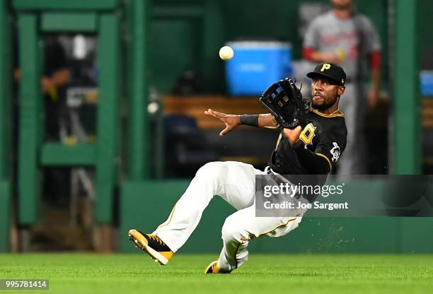 Starling Marte of the Pittsburgh Pirates makes a catch on a ball off the bat of Anthony Rendon of the Washington Nationals during the eighth inning...