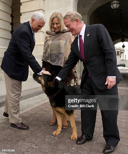 From left, Rep. Mike Pence, R-Ind., Ben, a military working dog rescued from Pakistan, Ben's new owner J.P. Gabriel, of Felmington, N.J., and Rep....