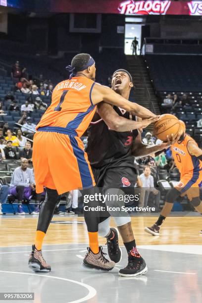 Demarr Johnson captain of 3's Company fights for the ball from Al Harrington co-captain of Trilogy during game 1 in week three of the BIG3 3-on-3...