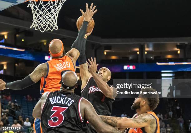 Drew Gooden co-captain of 3's Company goes up to block a shot by Dahntay Jones of Trilogy during game 1 in week three of the BIG3 3-on-3 basketball...