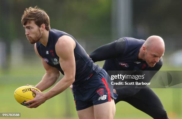 Jack Viney of the Demons is tackled by Nathan Jones of the Demons during a Melbourne Demons AFL training session at Gosch's Paddock on July 11, 2018...