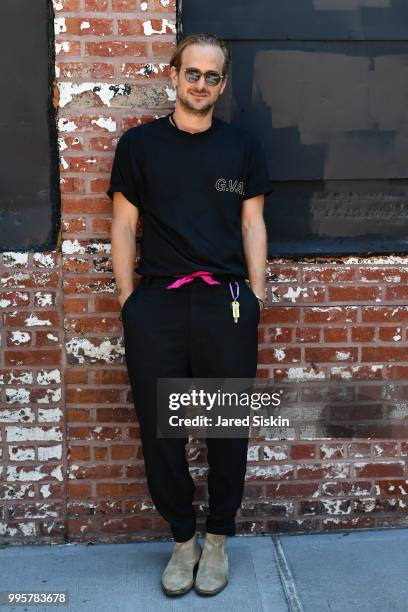 Designer Robert Geller is seen during July 2018 Men's Fashion week wearing his own line paired with Commen Project x Robert Geller boots outside of...