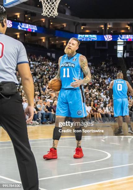 Chris 'Birdman' Andersen of Power has some words with the official after a play during game 3 in week three of the BIG3 3-on-3 basketball league on...