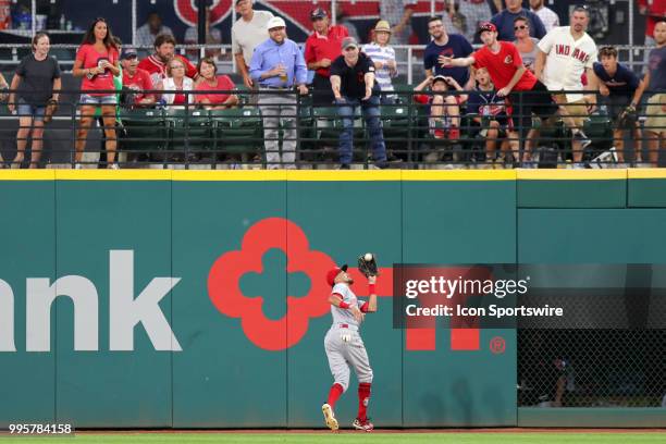 Cincinnati Reds center fielder Billy Hamilton makes a catch on the track for an out during the eighth inning of the Major League Baseball Interleague...