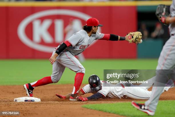 Cleveland Indians third baseman Jose Ramirez slides into second base with a double as Cincinnati Reds infielder Alex Blandino takes the throw during...