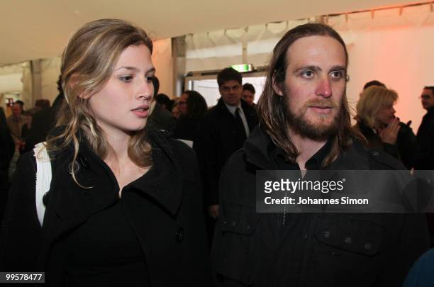 Actor Frederick Mayet and his girlfriend arrive for the reception of the Bavarian state governement after the first half of the premiere of the...