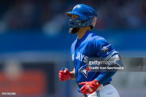 Toronto Blue Jays Outfield Teoscar Hernandez runs back to the dugout after being called out at First Base during the MLB game between the New York...