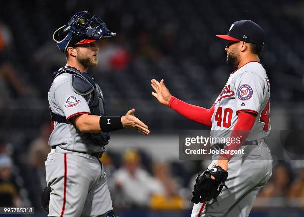 Kelvin Herrera of the Washington Nationals celebrates with Spencer Kieboom after a 5-1 win over the Pittsburgh Pirates at PNC Park on July 10, 2018...