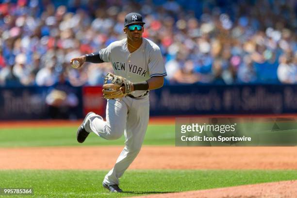 New York Yankees Third baseman Miguel Andujar prepares to throw out a runner at first during the MLB game between the New York Yankees and the...