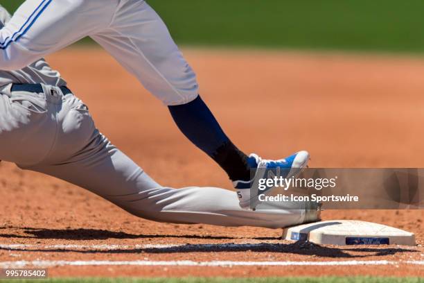 New York Yankees First base Greg Bird keeps his right foot planted against first base to beat the Jays' runner on the throw from teammate Shortstop...