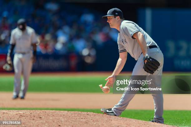 New York Yankees Pitcher Adam Warren tosses his rosin bag during the MLB game between the New York Yankees and the Toronto Blue Jays at Rogers Centre...