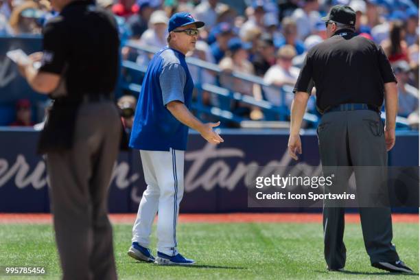 Toronto Blue Jays manager John Gibbons argues with MLB Third Base Umpire Lance Barrett after Toronto Blue Jays Fist Base Coach Tim Leiper was tossed...