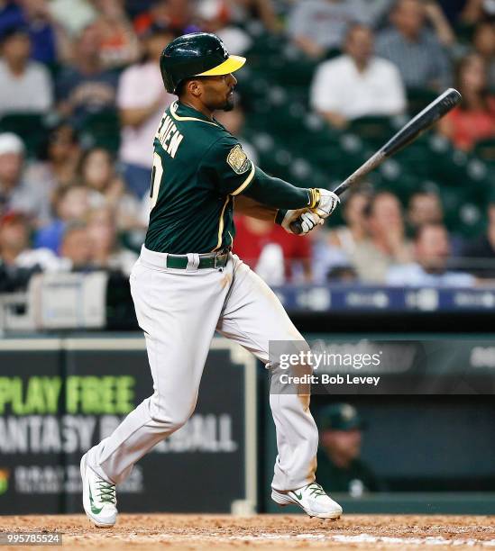 Marcus Semien of the Oakland Athletics doubles in two runs in the ninth inning to tie the game against the Houston Astros at Minute Maid Park on July...
