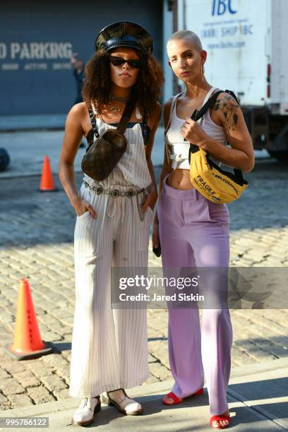 Rachel McGee and Emily Lepsock attend July 2018 Men's Fashion week outside of Industria Studios on July 10, 2018 in New York City.