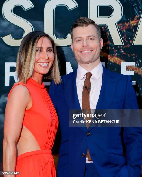 Director Rawson Marshall Thurber and a guest attend the premiere of 'Skyscraper' on July 10, 2018 in New York City.
