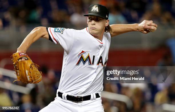 Miami Marlins reliever Adam Conley pitches in the seventh inning against the Milwaukee Brewers at Marlins Park in Miami on Wednesday, July 10, 2018....