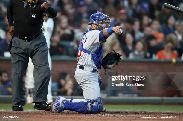 Willson Contreras of the Chicago Cubs points to the first base umpire during the fourth inning of their game against the San Francisco Giants at AT&T...