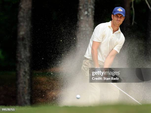 Actor Oliver Hudson hits onto the fourth green during the third round of the BMW Charity Pro-Am at the Thornblade Club held on May 15, 2010 in Greer,...