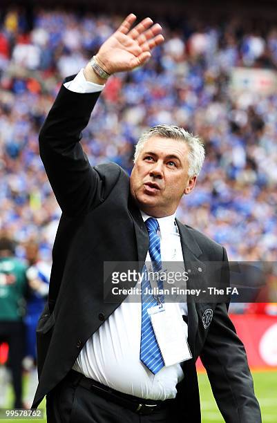 Carlo Ancelotti, manager of Chelsea, waves to the fans following his team's victory in the FA Cup sponsored by E.ON Final match between Chelsea and...