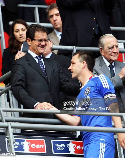 John Terry of Chelsea is congratulated by England manager Fabio Capello after his team's victory in the FA Cup sponsored by E.ON Final match between...