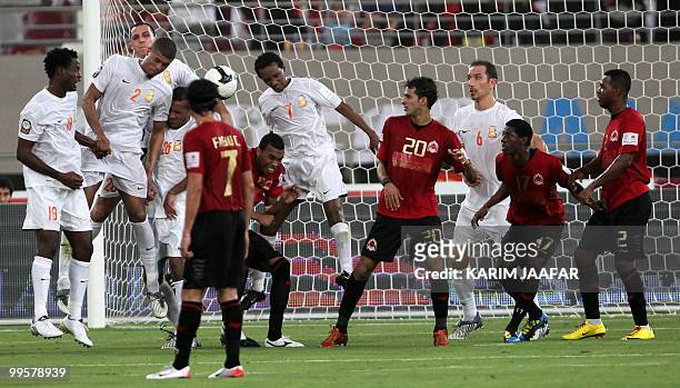 Umm Salal's players compete with Al-Rayyan's team during the Emir Cup final football match in Doha on May 15, 2010. AFP PHOTO/KARIM JAAFAR