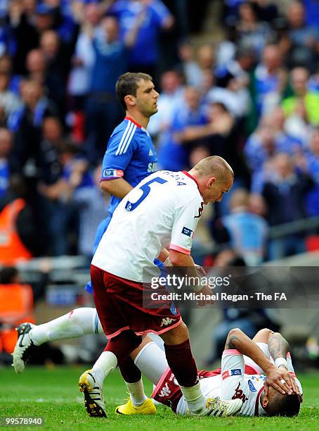 Jamie O'Hara of Portsmouth consoles team-mate Kevin-Prince Boateng following his penalty being saved during the FA Cup sponsored by E.ON Final match...