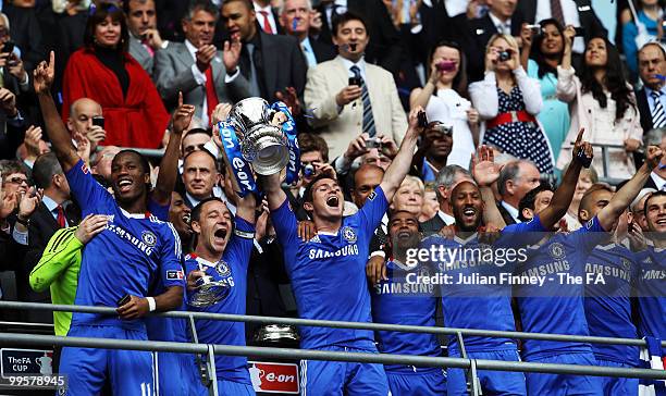 John Terry and Frank Lampard of Chelsea lift the trophy as their team-mates celebrate following their victory in the FA Cup sponsored by E.ON Final...